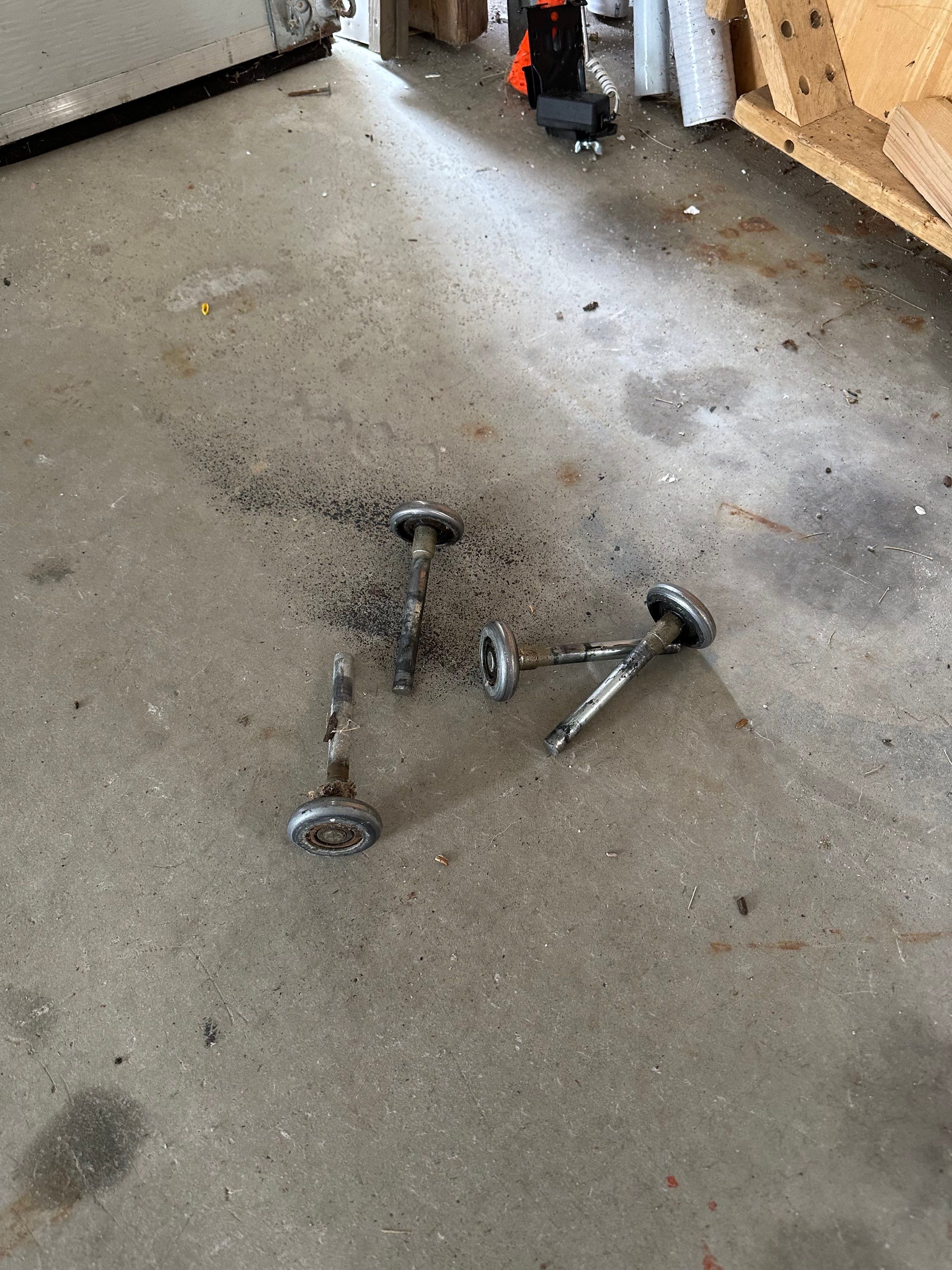 Garage door service professional repairing garage door rollers in Dayton Ohio
